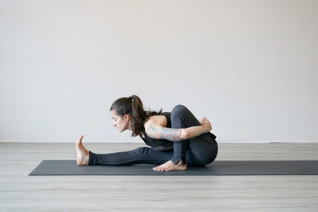 woman practicing hot yoga on best yoga mats for hot yoga