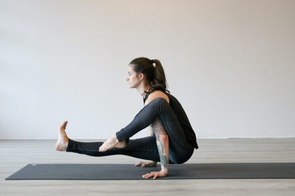 a woman practicing yoga on best yoga mats for hot yoga
